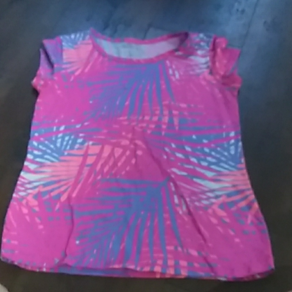 Pink  shirt with colorful leaves on it